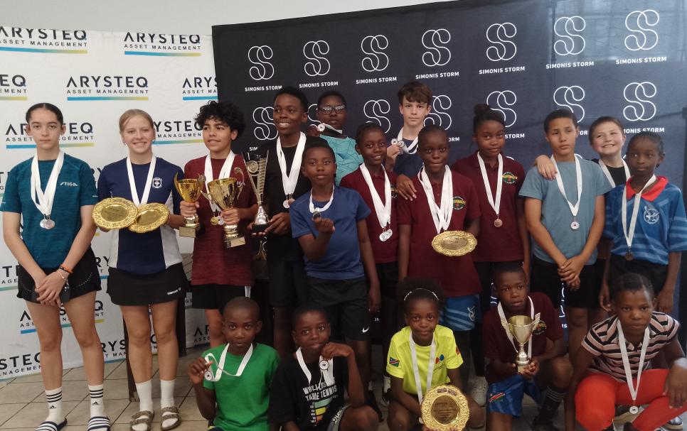 Table Tennis players posing for a picture after a tournament