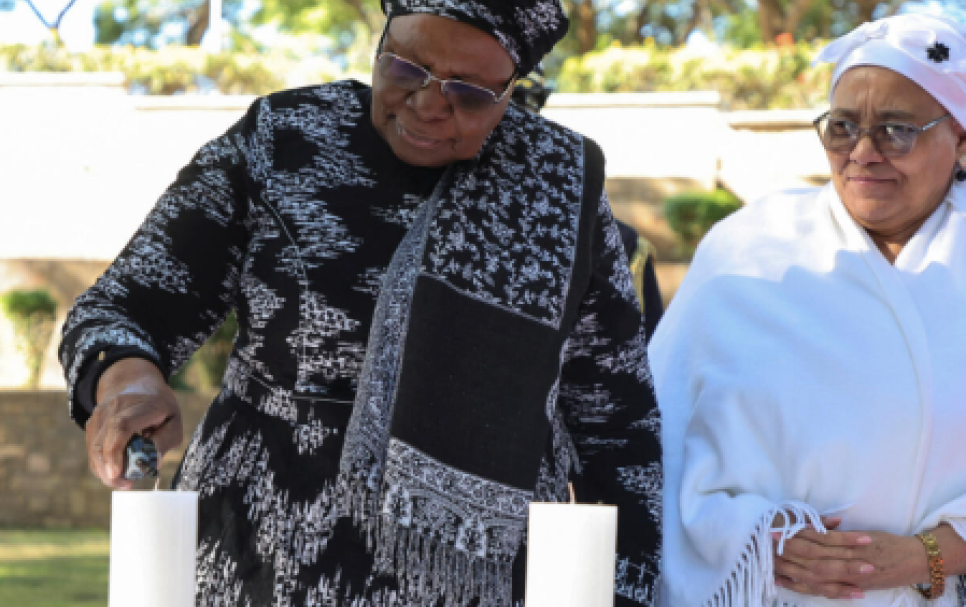 President Netumbo Nandi Ndeitwah lighting a candle at the commemoration with Hon-Vice Predisent of Namibia Lucia Witbooi