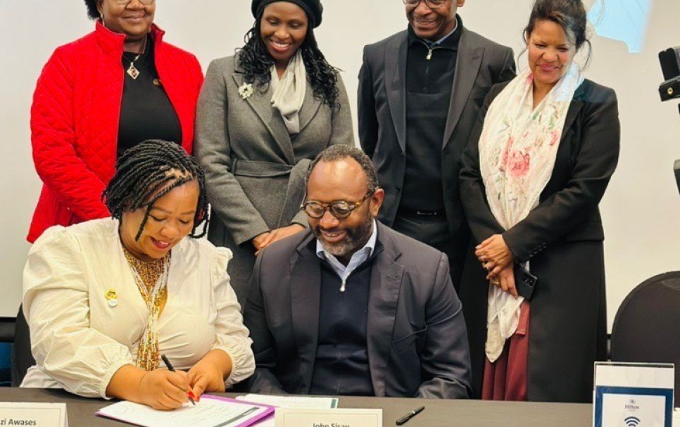 Zenzi Awases, president of WiMAN and John Sisay, co-founder and chief executive officer at the signing ceremony for a collaborative mentorship programme for Namibian women in mining.