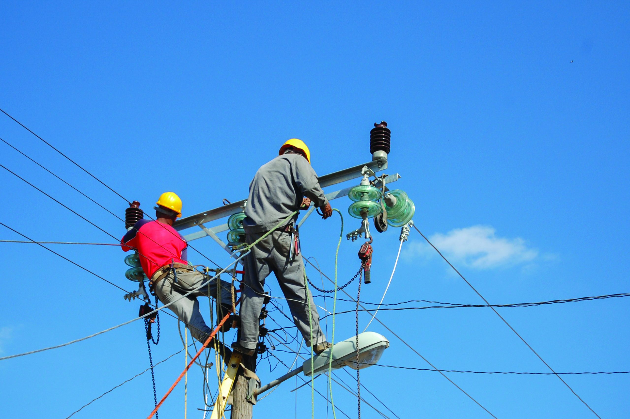 Helao Nafidi residents demand electrification low-angle-shot-electric-linemen-working-pole